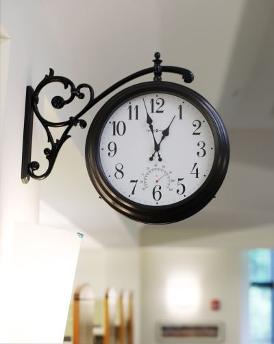 train station clock hanging in library