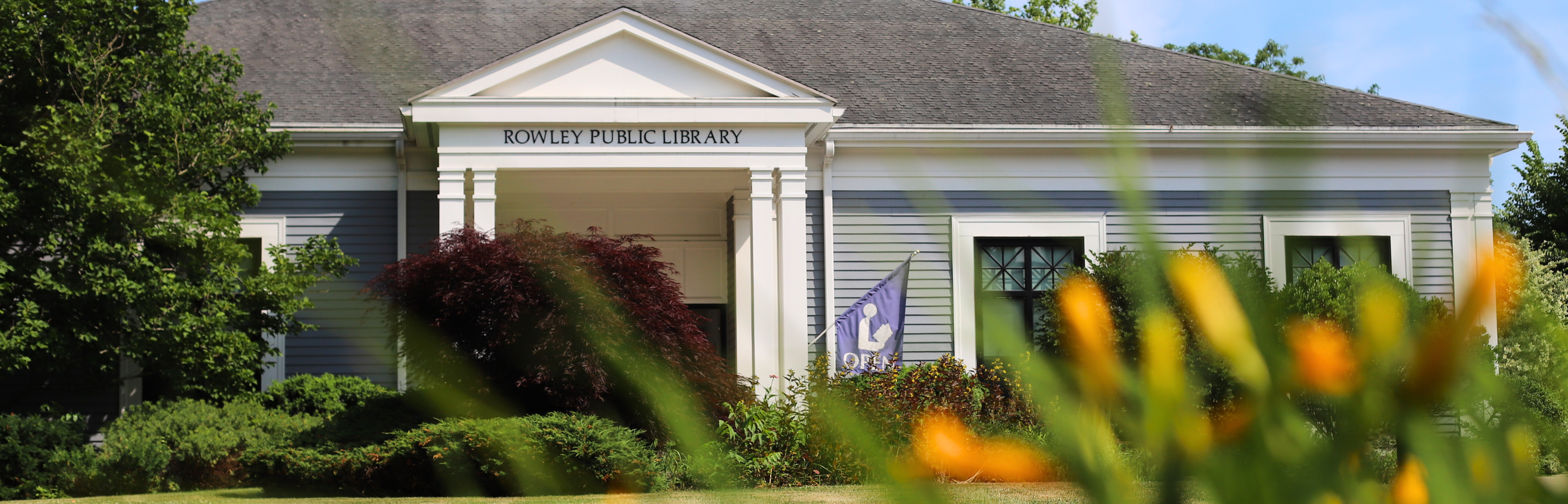 library facade with lilies in the foreground